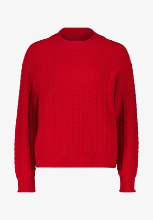 Piros kötött pulóver, texturált csepp mintával, kerek nyakkivágással és bordázott ujjakra és aljára. Lazán illeszkedő, hosszú ujjú.