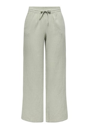 Pantalons larges vert clair en tissu texturé, dotés d'une taille élastique avec cordon de serrage et de poches latérales.