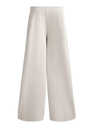 Wide-leg sweatpants in light beige fabric, featuring a smooth texture, elastic waistband, and side seam details. No pockets visible.