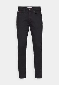 Černé džíny z denimu se slim fit střih, obsahující pět kapes, decentní švy a zapínání na knoflík v pase.