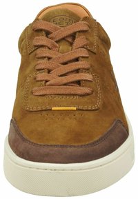Brown suede sneaker featuring a lightweight design, round toe, textured accents, brown laces, and a white rubber sole with a subtle pattern.