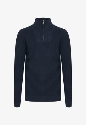 Suéter de punto navy con cuello alto y media cremallera. Diseño texturizado, mangas largas y puños y dobladillo acanalados.