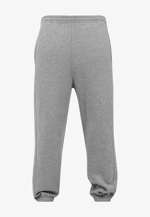 Szare dresy wykonane z mieszanki bawełny, z elastycznym pasem w talii, ściągaczami na kostkach oraz bocznymi kieszeniami. Gładka tekstura z minimalnym przeszyciem.