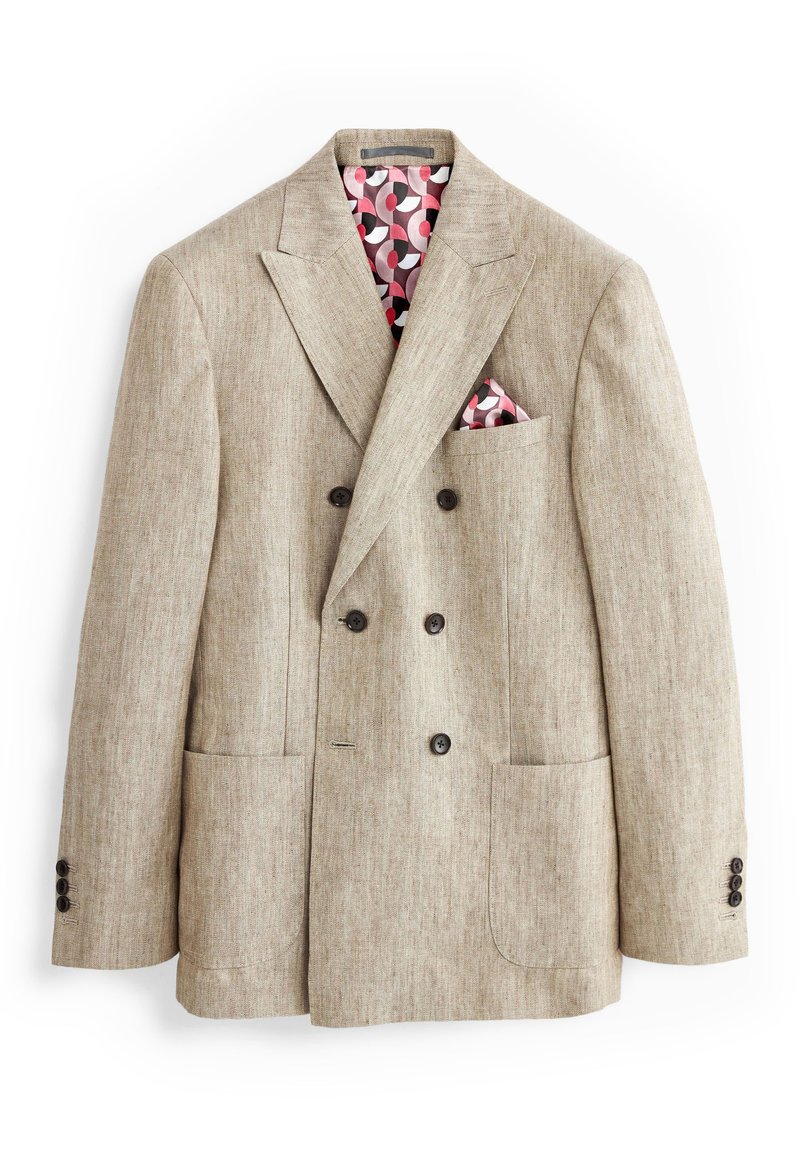 Beige dubbelzijdige blazer gemaakt van textuurstof, voorzien van vier knopen, twee voorzakken en een gemêleerde binnenvoering in roze en grijs.