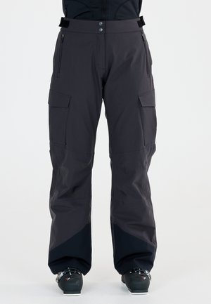 Black waterproof ski pants with a relaxed fit, reinforced knees, and multiple pockets. Features a smooth texture and contrasting dark accents.