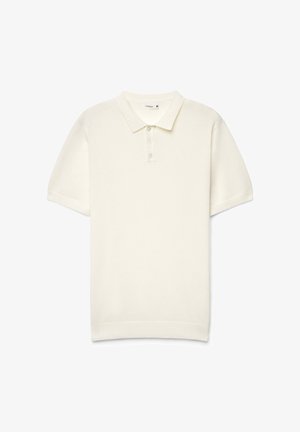 Polo a maniche corte color crema in morbido cotone. Presenta un colletto classico, una patta con tre bottoni e polsini a costine.