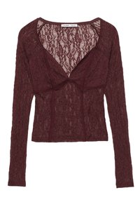 Hosszú ujjú bordó csipke felső mély V-nyakkivágással, áttetsző virágmintával és testhez simuló szabással.