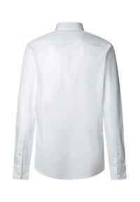 Chemise blanche à manches longues avec un col classique, texture lisse, détail de empiècement au dos et poignets à boutons. Coupe ajustée avec un ourlet arrondi.