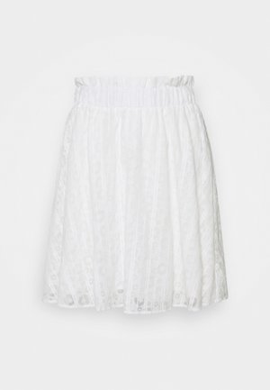 Jupe patineuse blanche en tissu léger et texturé avec une taille élastique et un motif en relief subtil sur l'ensemble.