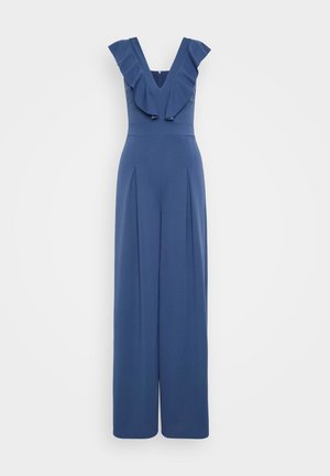 Tuta blu con scollatura a V profonda e spalle arricciate. Presenta gambe larghe, una trama morbida e pieghe sul davanti per dettagli extra.