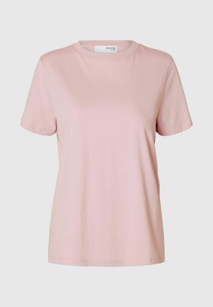 Camiseta de algodón rosa con mangas cortas, cuello redondo y un corte holgado. Textura suave y sin patrones ni acentos visibles.