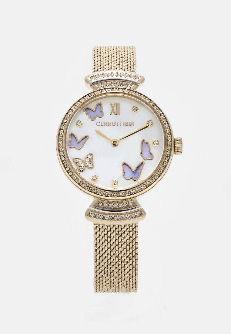 Montre dorée avec un bracelet en maille, cadran blanc mettant en avant des papillons décoratifs, accents en cristal et index horaires dorés. Design élégant.