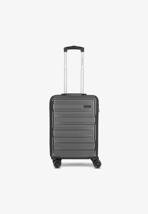 Hard-shell carry-on suitcase in dark gray, featuring a textured finish, four spinner wheels, dual retractable handle, and a zipper closure.