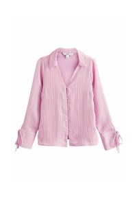 Chemisier long à manches roses claires avec col, devant à boutons et tissu texturé. Présente des accents à nouer aux poignets.