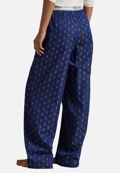 Blåpyjamasbyxor med ett upprepande mönster av ljusgråa polo-spelare, elastisk midja med "POLO RALPH LAUREN"-logotyp, avslappnad passform.