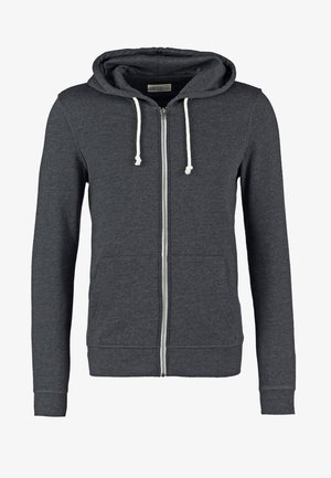 Grå hettejakke med glidelås laget av mykt stoff, med snorhetter, to frontlommer og ribbede mansjetter og nederkant.