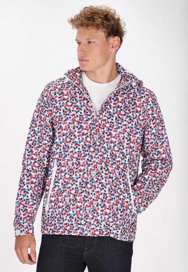 Jachetă multicolor cu un model floral în roșu, albastru și alb. Dispune de un fermoar frontal, glugă și două buzunare laterale cu fermoar.