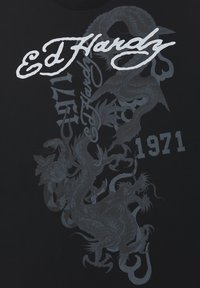 Ed Hardy design with large white script text and a detailed dark grey dragon intertwined with "1971" on black fabric.