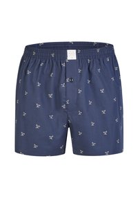 Boxer blu navy in tessuto leggero, con motivi di uccelli bianchi, un elastico in vita e chiusura anteriore con bottone.