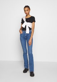Levi's® 725™ HIGH RISE BOOTCUT - Calças de ganga bootcut - blue denim