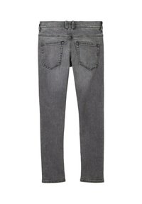 Šedé džíny z denimu s úzkým střihem, pěti kapsami a mírným blednutím. Obsahují standardní pas a zakončené manžety.