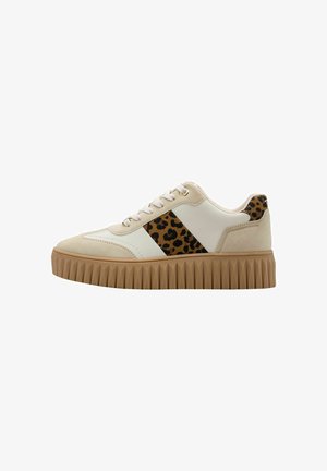 Beige and white platform sneaker with brown ribbed sole and leopard print accents on side and heel, lace-up closure.