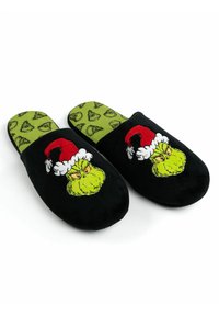 Black plush slippers featuring a green Grinch design with a red Santa hat. The insole has a green background with Grinch-themed patterns.