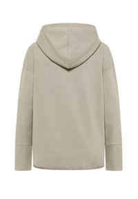Mikina s kapucňou v svetlobéžovej farbe, s dlhými rukávmi, voľným strihom a hladkou textúrou, s zaobleným lemom a minimálnym prešívaním.