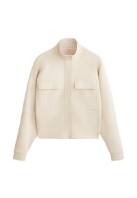 Giacca cropped beige realizzata in materiale testurizzato, con colletto alto, chiusura frontale a bottoni e due tasche sul petto con pattina.
