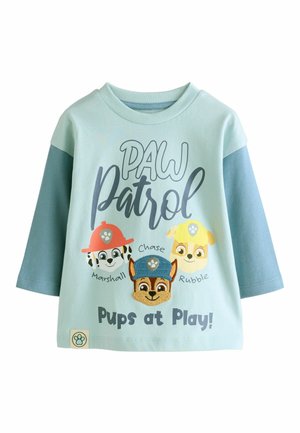 Hellblaues Baumwoll-T-Shirt mit drei Comic-Hundekaraktern, "Paw Patrol"-Schriftzug, kurzen Ärmeln und gestickten Details auf den Gesichtszügen der Hunde.