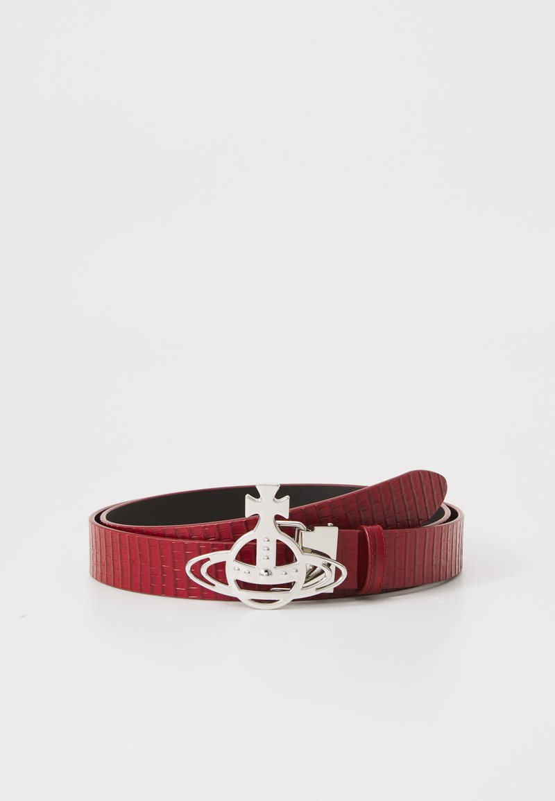 Red textured leather belt featuring a silver-tone buckle with a planet design and decorative accents. Smooth inner lining with adjustable length.