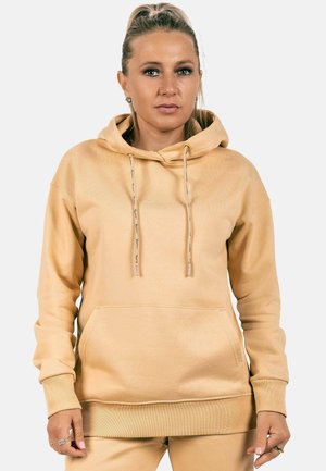 Lichtbeige hoodie van zacht materiaal, met een voorzak, verstelbare koordjes en ribgebreide manchetten. Soepele textuur.