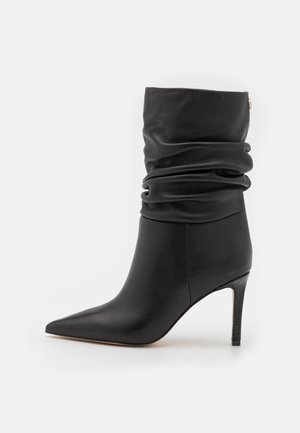 Enkellaarsjes met hoge hak - black