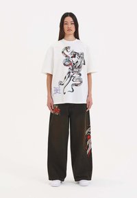 Ed Hardy DEATH BEFORE DISHONOR XTRA  - Flared jeans - black
