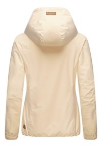 Light beige waterproof jacket with a large hood, elastic cuffs, and a small branded leather patch at the lower hem, smooth textured fabric.