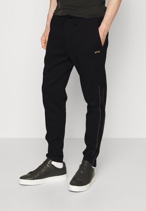 HADIM - Tracksuit bottoms - black