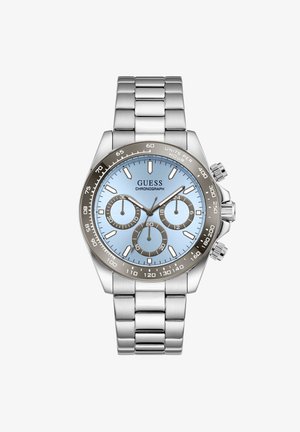 Ezüst színű rozsdamentes acél Guess kronográf óra világoskék számlappal, három segédszámlappal és tachyméteres lünettával, fém szíjjal.
