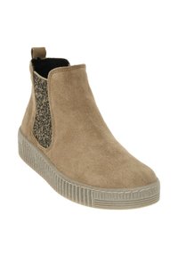 Botines de ante en color beige con un panel lateral elástico negro texturizado y una suela de goma estriada. El diseño cuenta con una tira en la parte trasera.