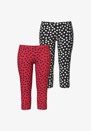 To par capri-leggings, den ene rød med sorte polkaprikker og den anden sort med hvide polkaprikker, vist side om side.