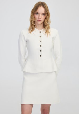 PEPLUM - Polo - ecru