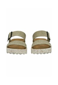 Sandali platform beige con due cinturini in tessuto e una fibbia laterale. Suola leggera texturizzata con bordo ondulato. Soletta morbida e imbottita.