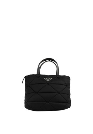 Black quilted handbag with dual short handles and a triangular Prada logo plaque on the front center.