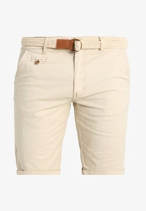Beige shorts med et flettet, lyse farget belte. Har knappelukking og frontlomme. Laget av bomull med en glatt tekstur.