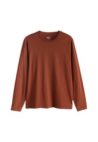 Pitkähihainen T-paita ruosteenvärisestä puuvillasta, pyöreällä kaula-aukolla ja suoralla istuvuudella. Ei näkyviä kuvioita tai koristuksia.