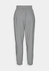 Leichte Jogginghosen mit elastischem Bund aus einem weichen, grauen Material. Sie besitzen elastische Bündchen und ein schlankes Design ohne sichtbare Hardware.