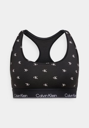 Must sportrinnahoidja racerback-disainiga, millel on valged logomustrid ja alumisel äärel bränditud elastne riba. Sile kangapind.