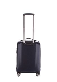 Valise rigide bleue marine avec un extérieur texturé, deux roues et une poignée télescopique. Design compact adapté au voyage.