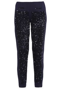 Marina leggings med vertikala paneler av paljetter. Mjuk tyg med en slät textur; åtsittande design med resårmidja.