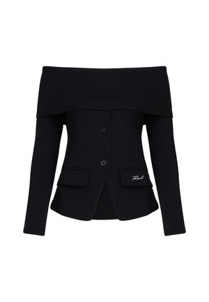 Off-the-shoulder black jacket made of soft fabric. Features two front pockets, three buttons, and embroidered logo on the left pocket.
