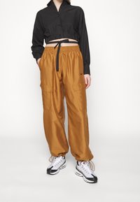 Nike Sportswear Träningsbyxor - brown